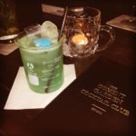 Green drink in measuring jug at covent garden cocktail club